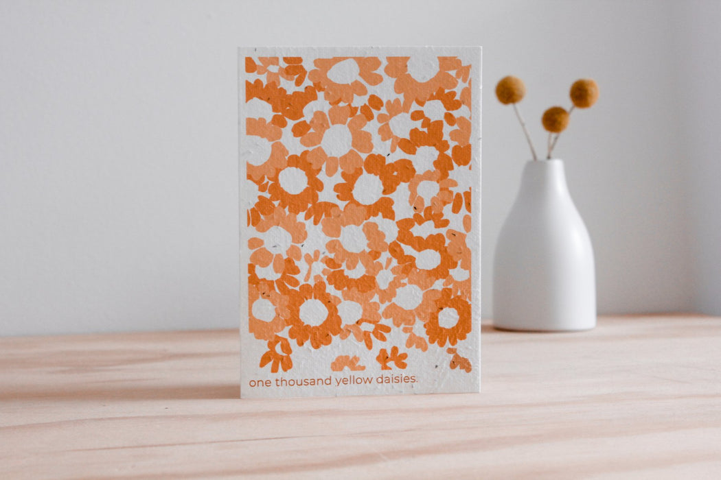 one thousand yellow daisies blooming card